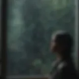A solitary figure gazing out at a rain-soaked window, reflecting on life.