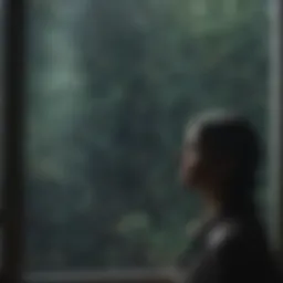 A solitary figure gazing out at a rain-soaked window, reflecting on life.