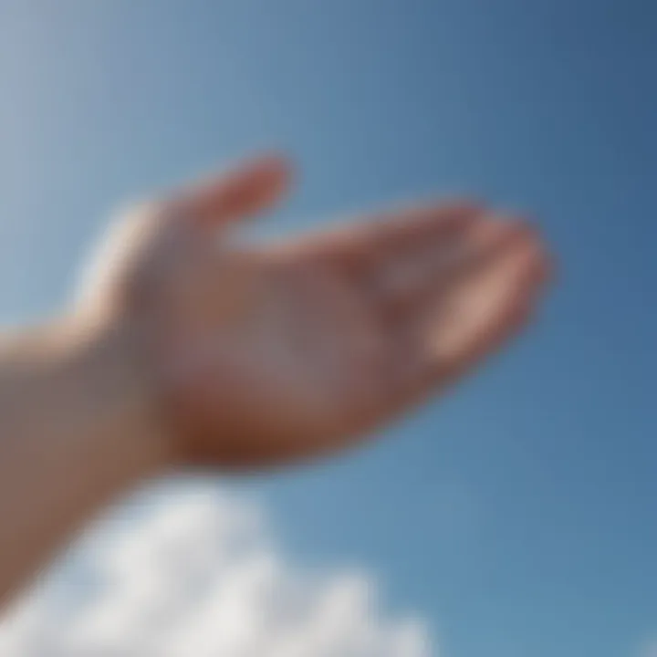 An open hand reaching towards the sky