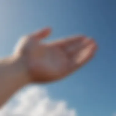 Embracing Support An open hand reaching towards the sky