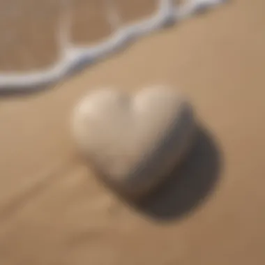 A heart-shaped stone on a sandy beach illustrating love and compassion