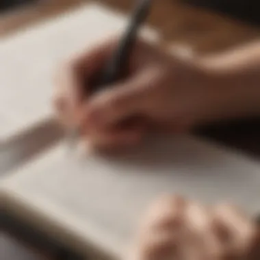 A close-up of a person writing affirmations in a journal